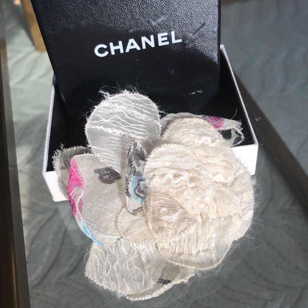 Chanel silk camellia brooch.